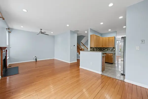 Family room with fireplace, open to the kitchen