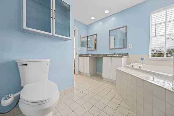 Primary bath with vanity and corner soaking tub